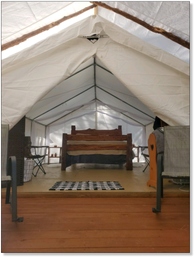 picture ofour glampng tent from the front entrance serving fourche mountain and the ouachita national forest